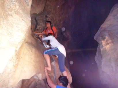Most of the time, the guides serves as human foot holds on this spelunking adventure.